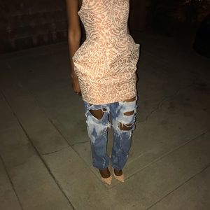 Spiked (pigalle louboutin look) nude pumps.